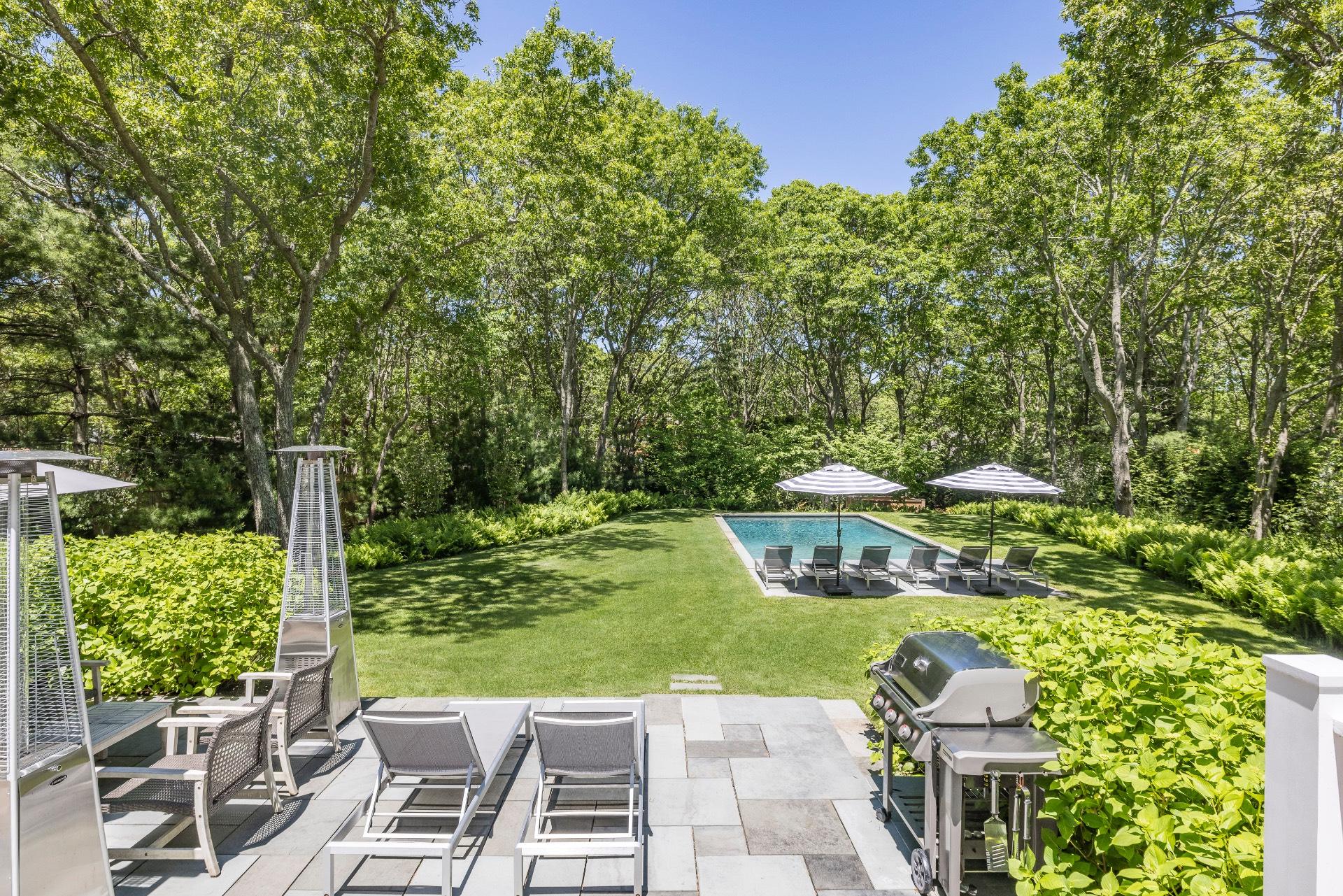 a view of yard with seating area and green space