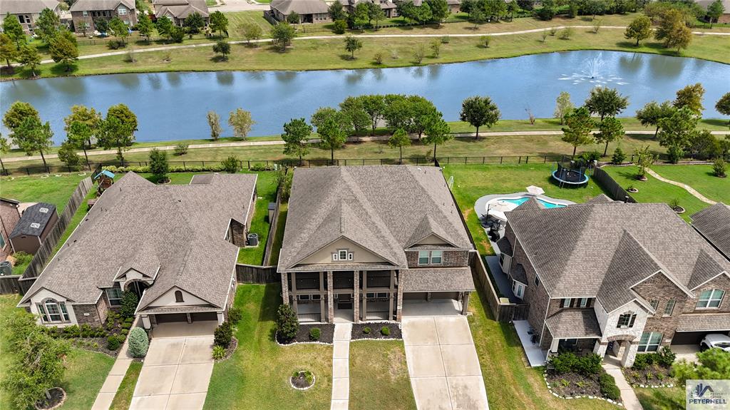 an aerial view of a house with garden space and outdoor seating