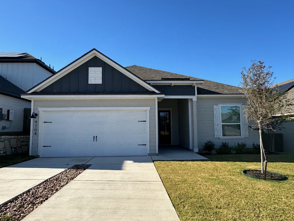 a front view of a house with a garage