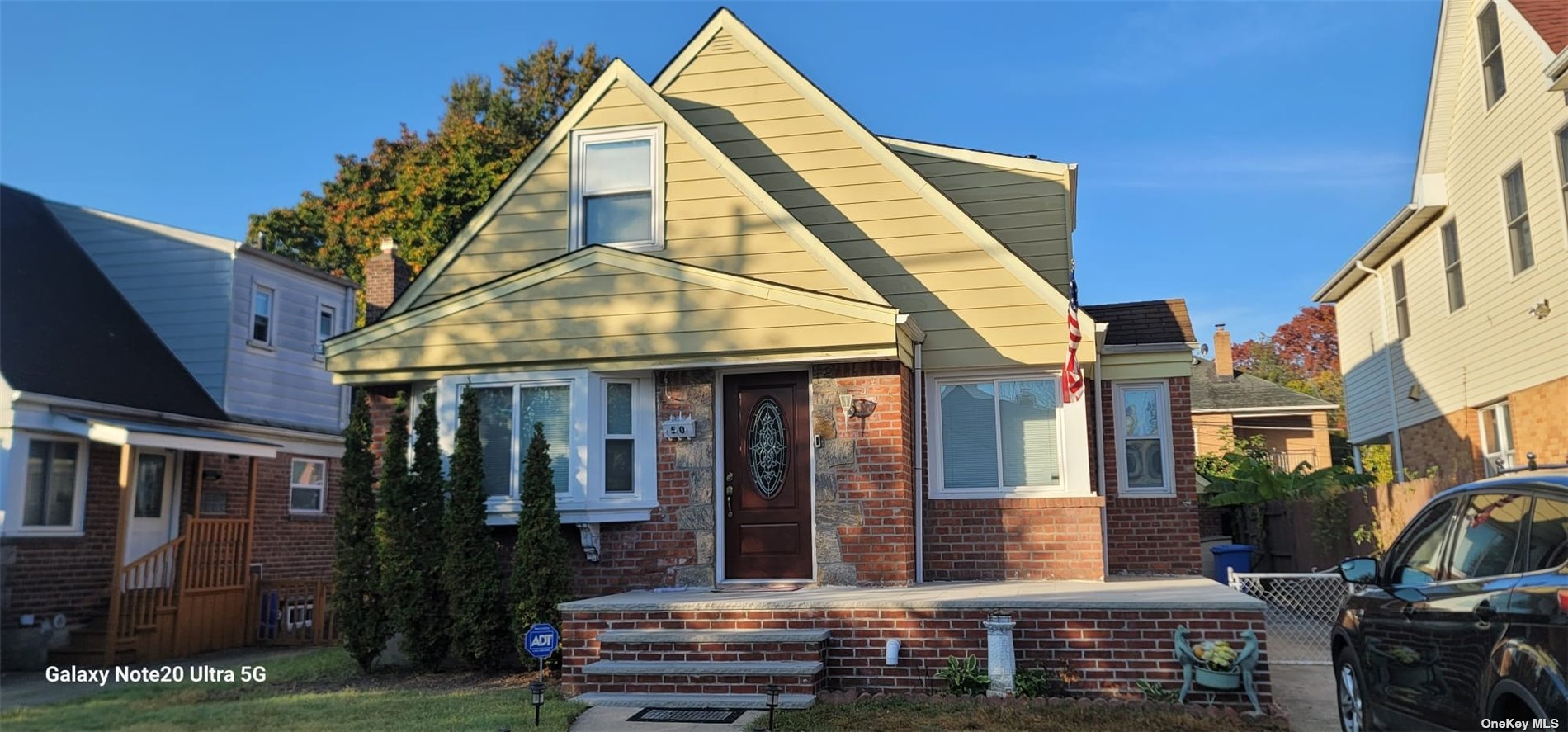 a view of house with a yard