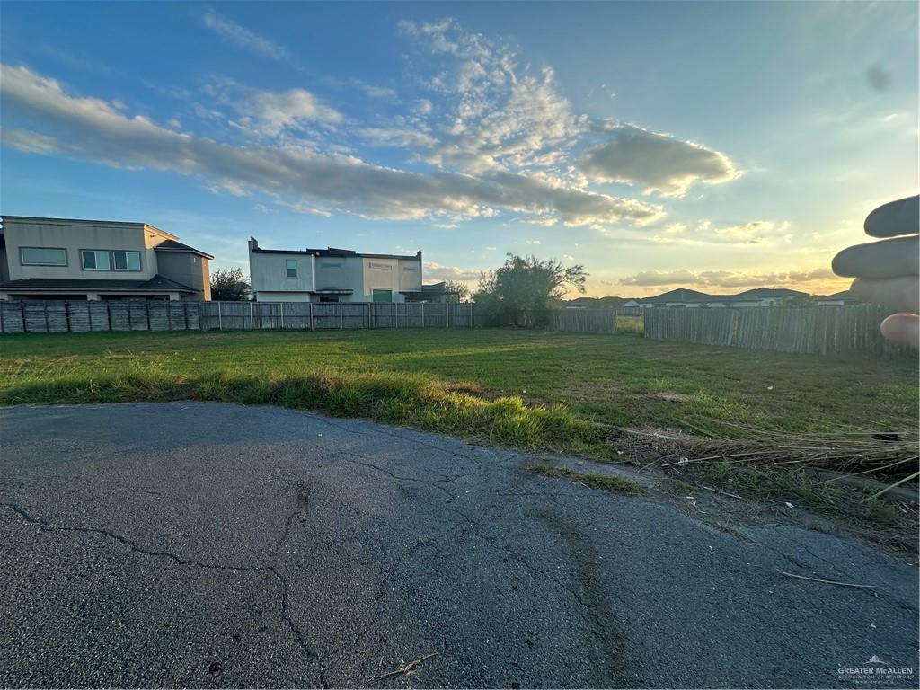 a view of a big house with a big yard