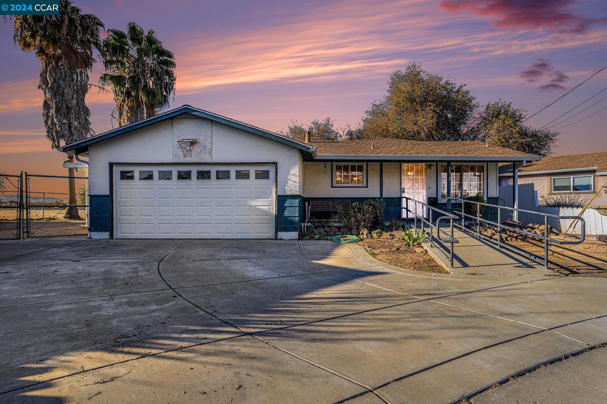 extra wide driveway, accessible walkway with handrails.  Side yard parking as well