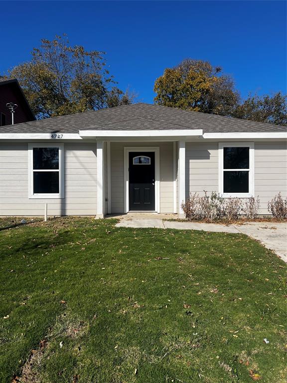 front view of a house with a yard