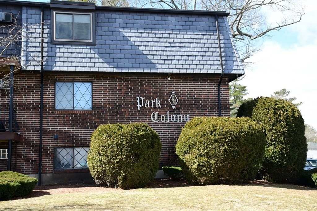 a view of a brick house with a large window