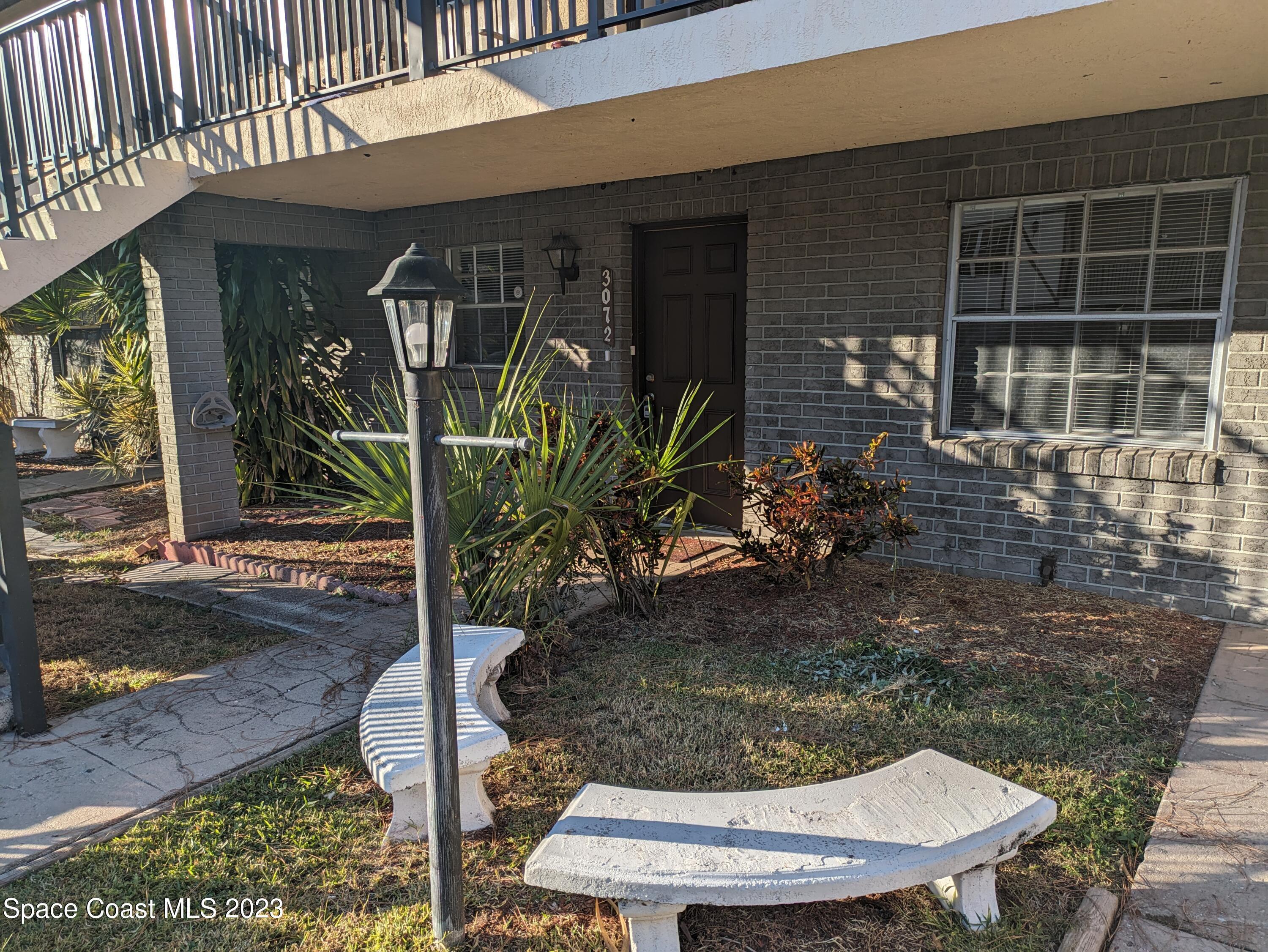 a view of a porch with seating space