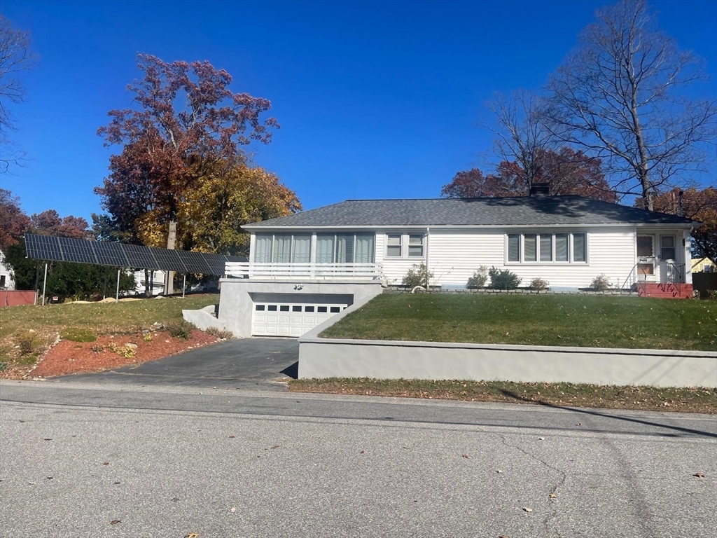 a house with trees in the background