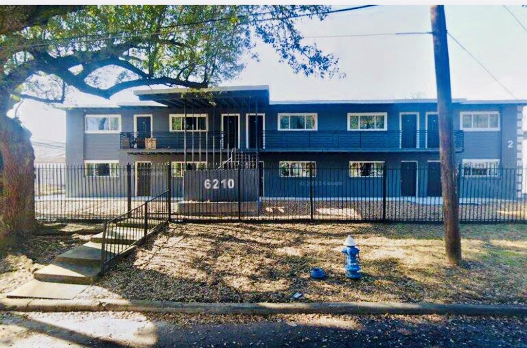 a front view of a houses on yard