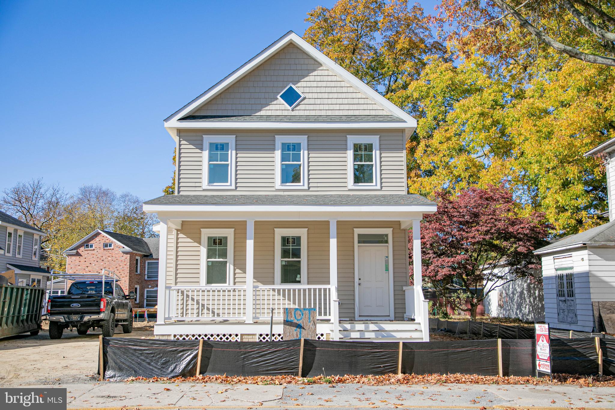 a front view of a house with a street