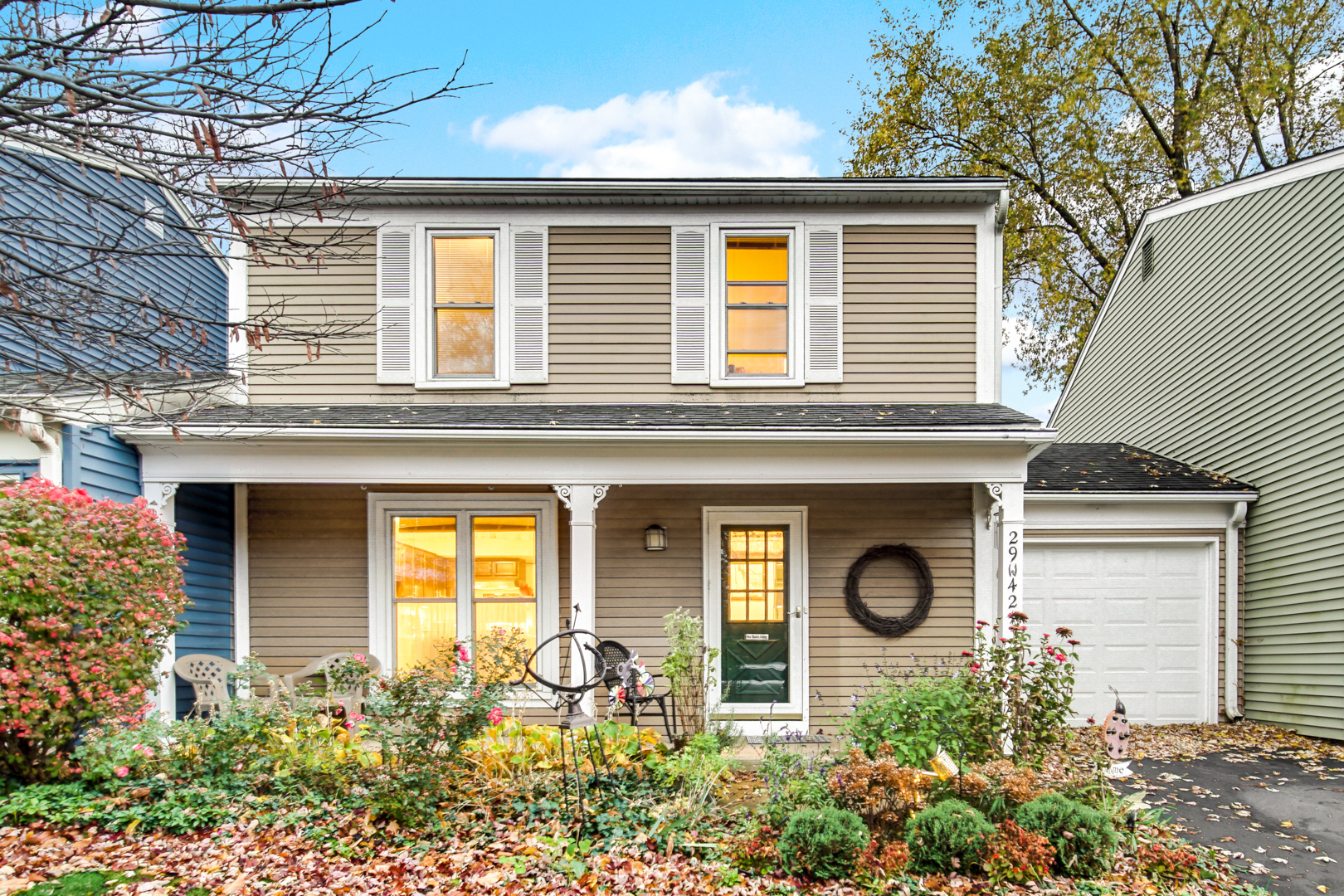 a front view of a house with garden