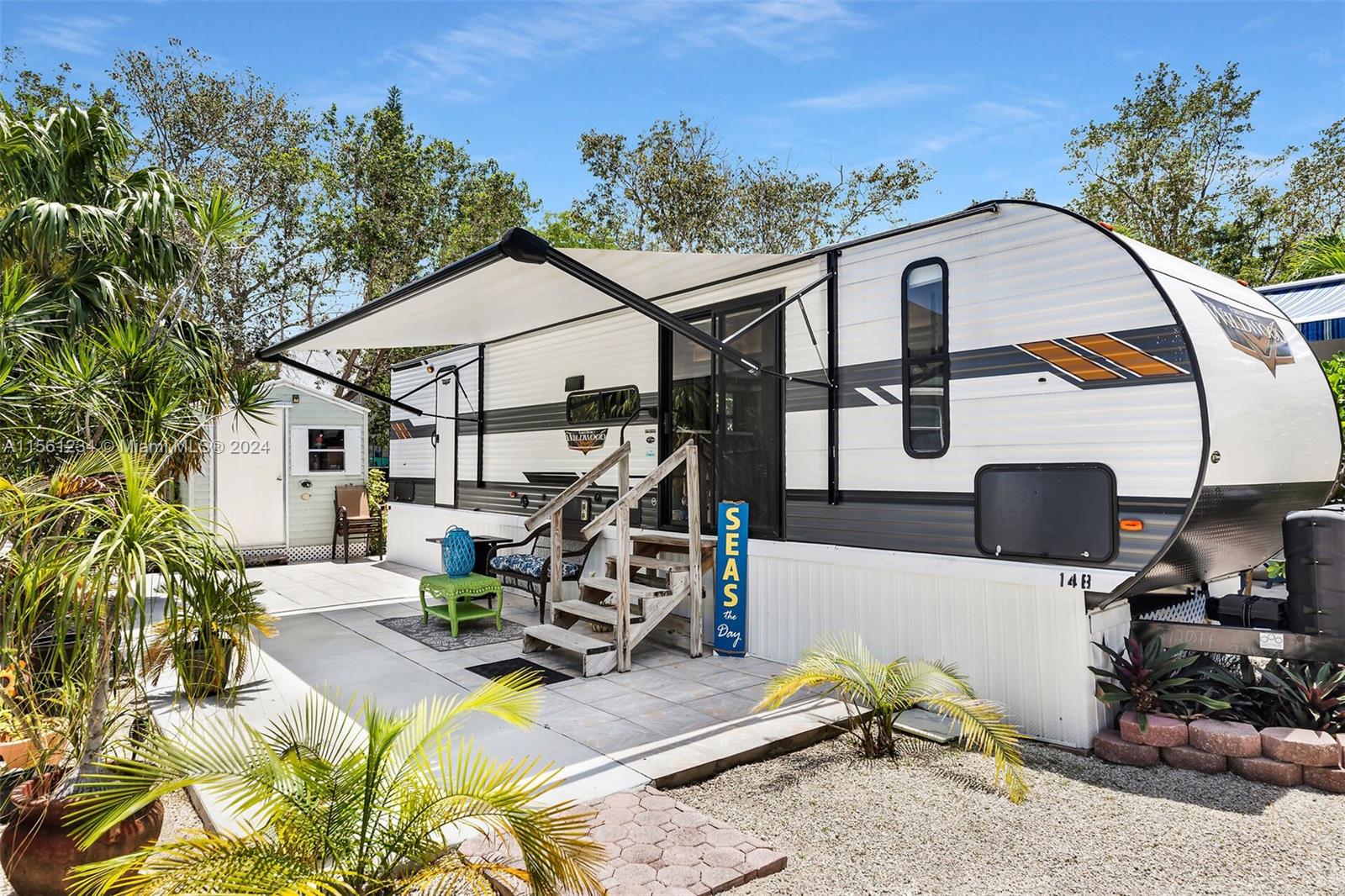 a view of backyard with a patio