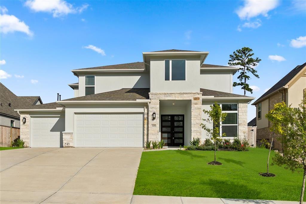 front view of a house with a yard