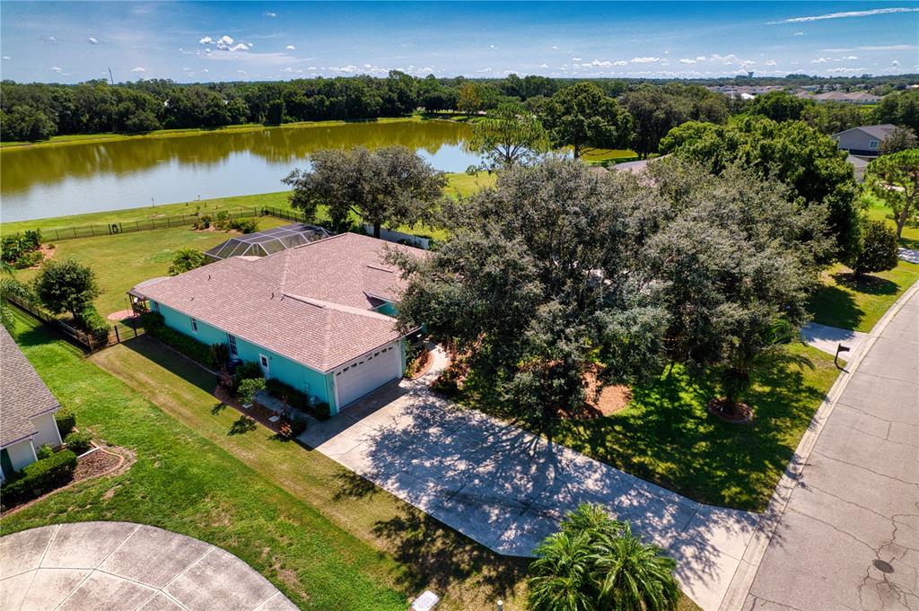 an aerial view of a house with a lake view