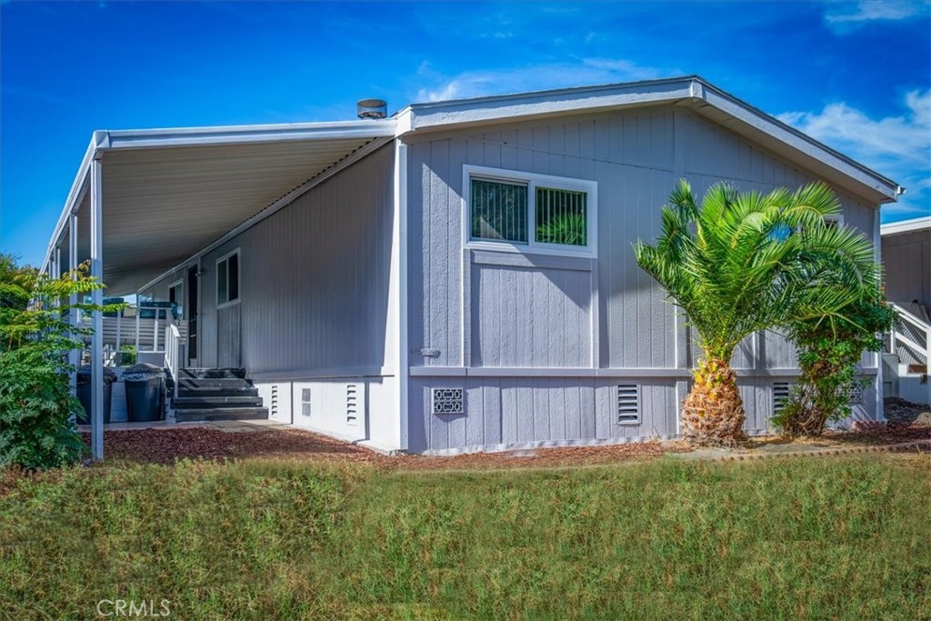 a view of front of house with a yard