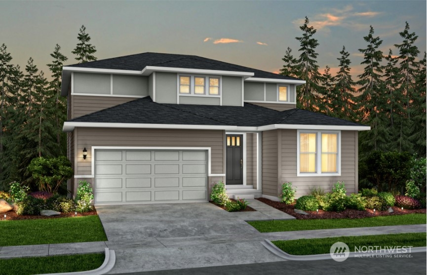 a front view of a house with a yard and garage