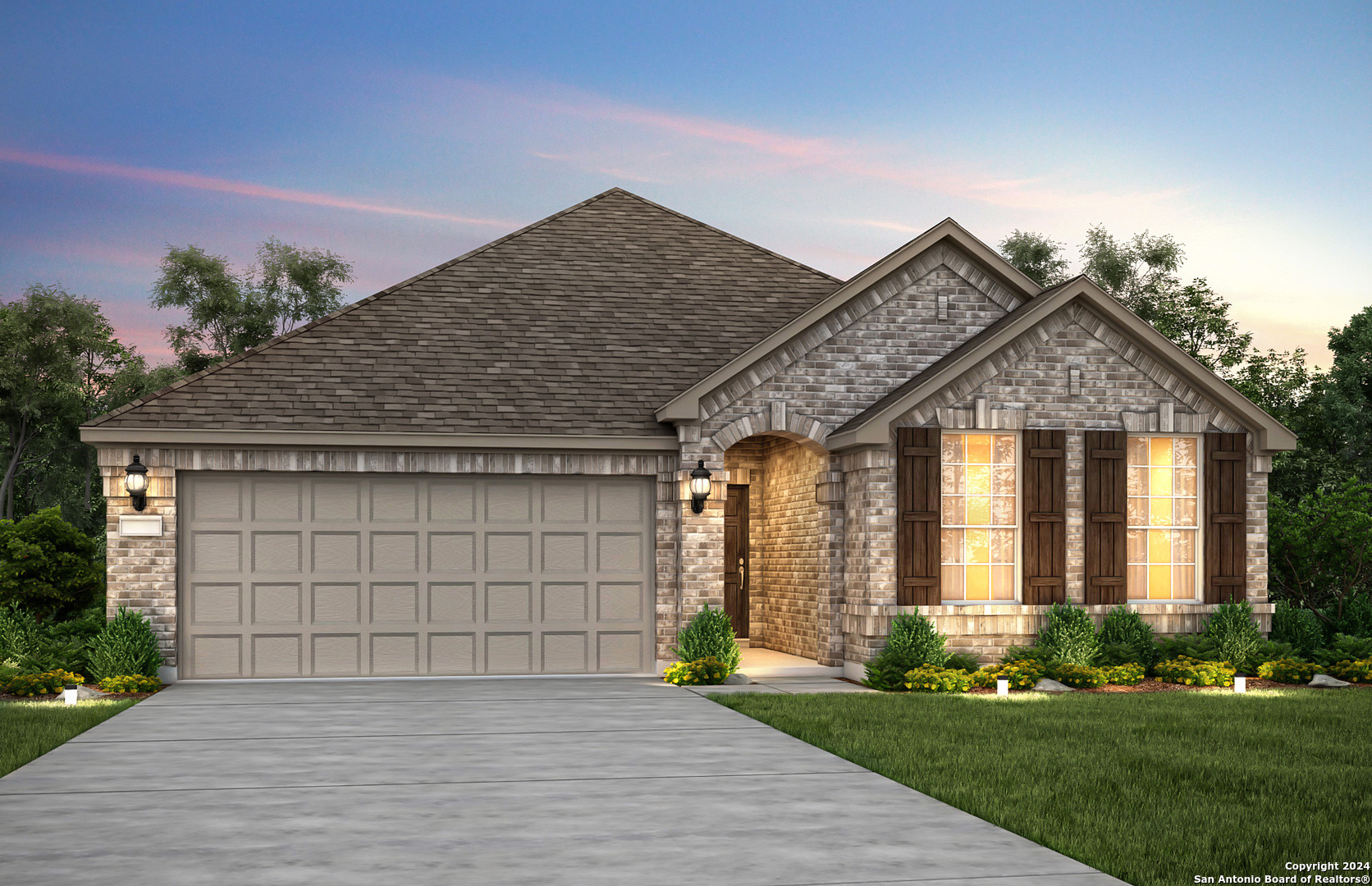 a front view of a house with a yard and garage