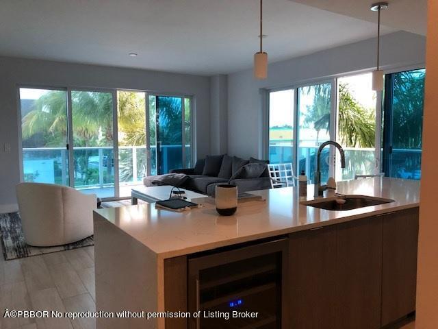 a kitchen with a sink and a large window