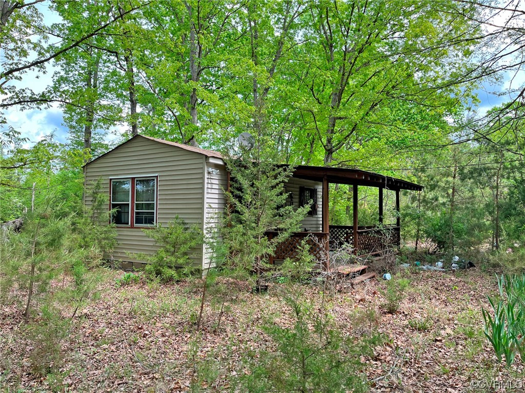 a house with green field in front of it