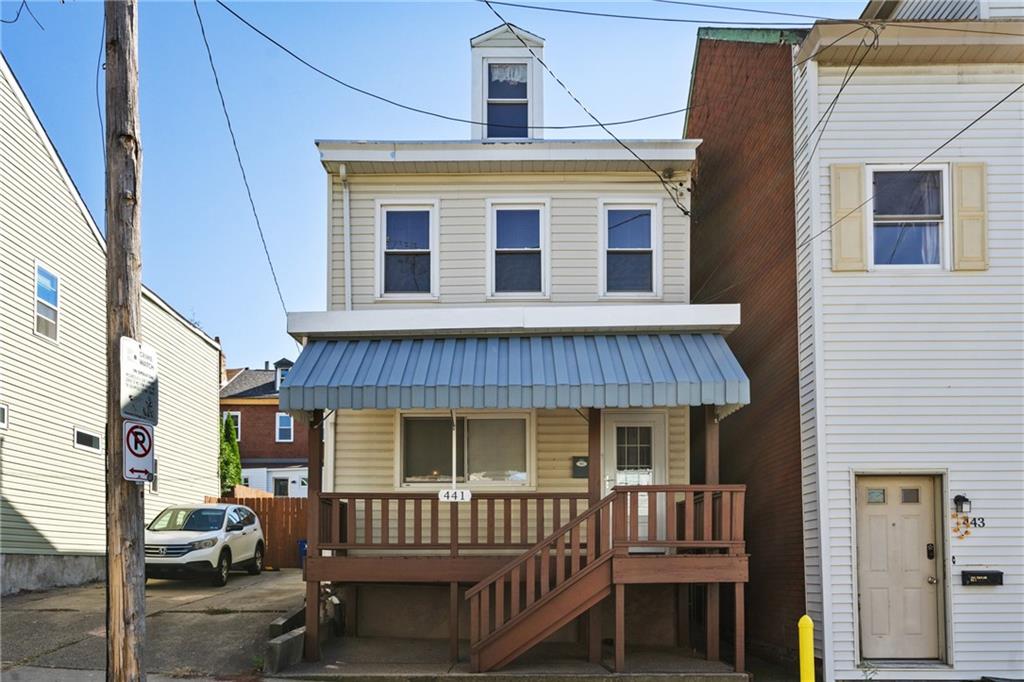 a front view of a house with a porch