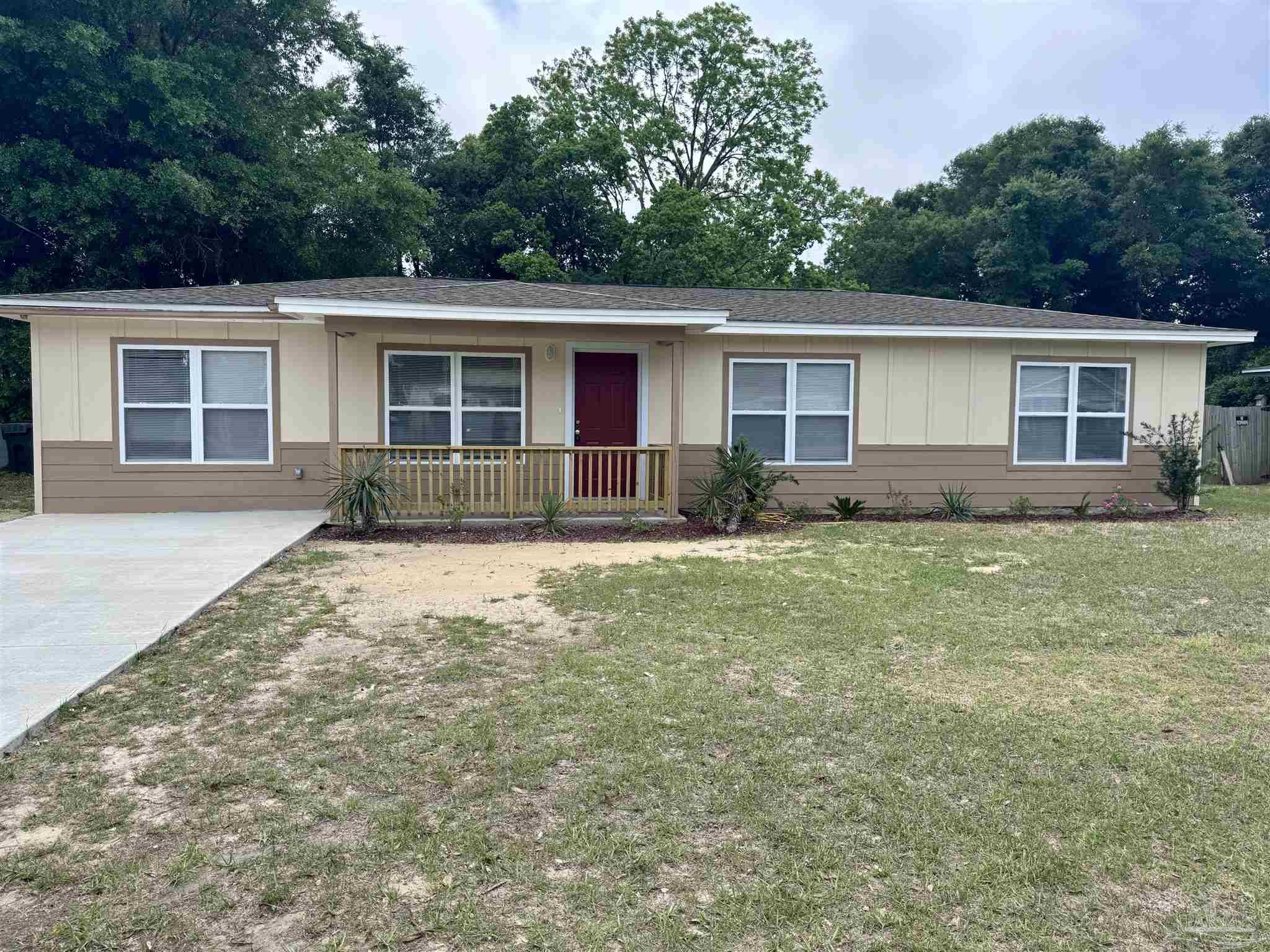 front view of a house with a yard