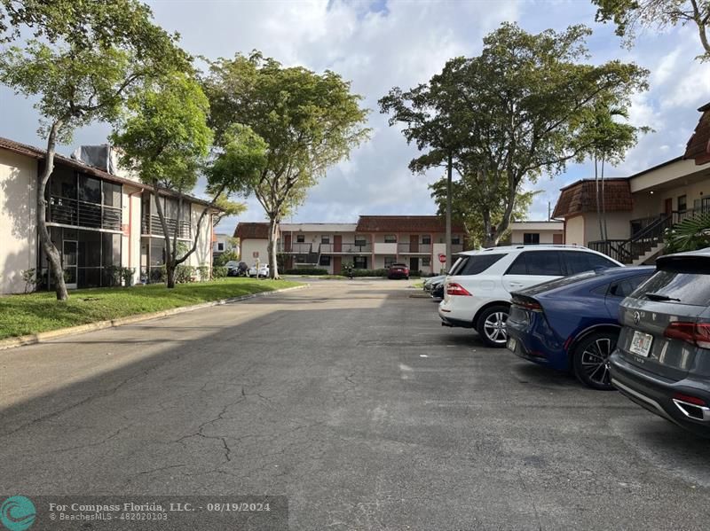 a view of street with parked cars