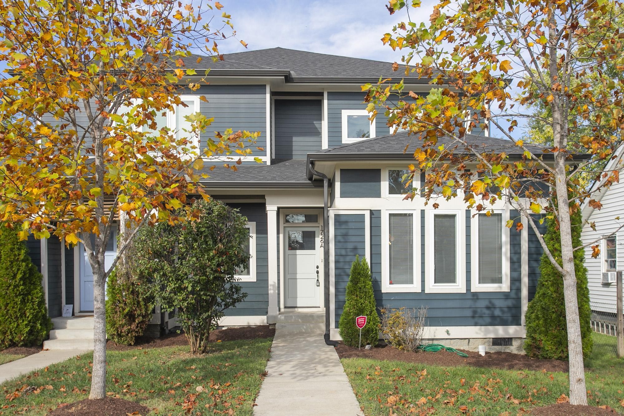 front view of a house with a yard