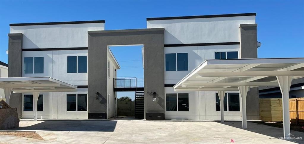 Rear view of house with a carport