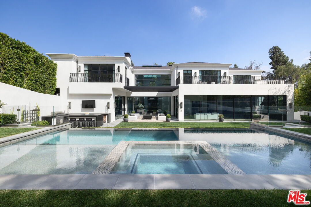 a view of a house with swimming pool