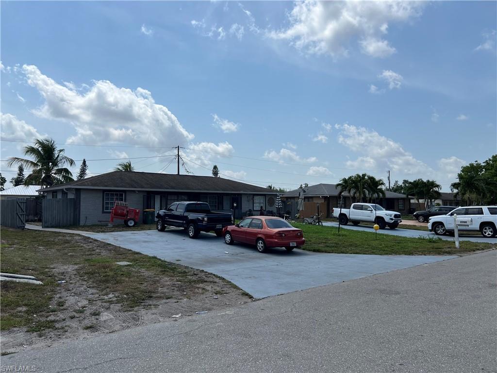 a view of car parked in front of a house