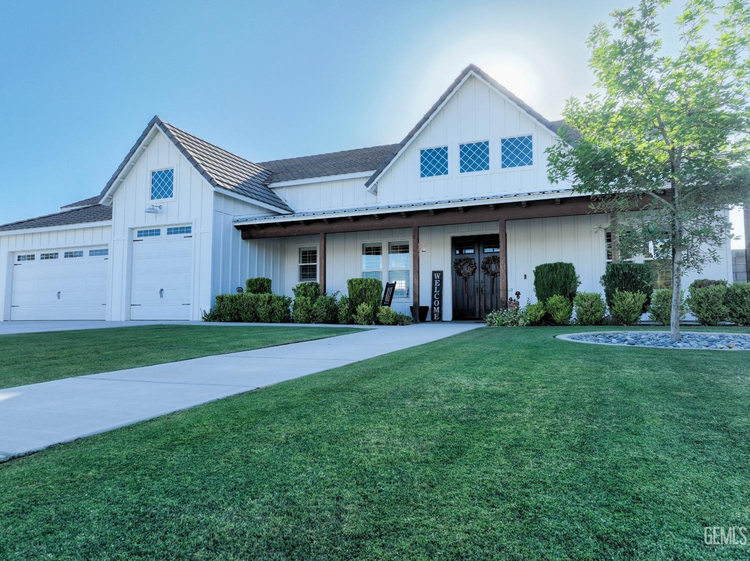 a view of a yard in front view of a house