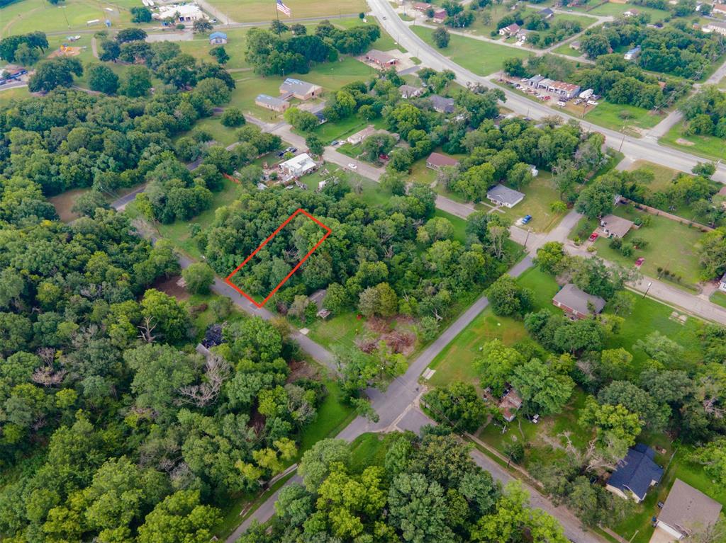 an aerial view of a houses with a yard