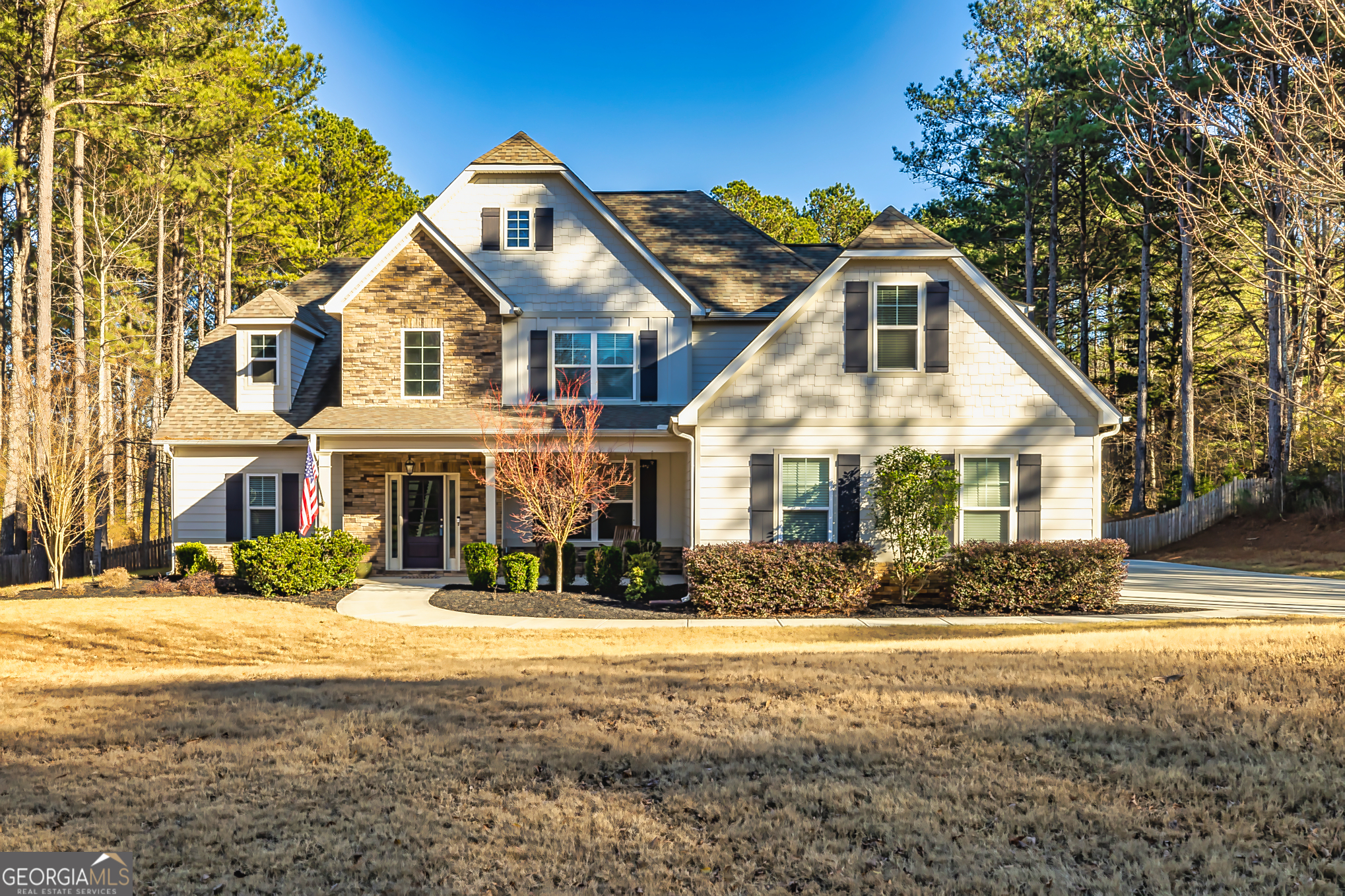 a front view of a house with a yard