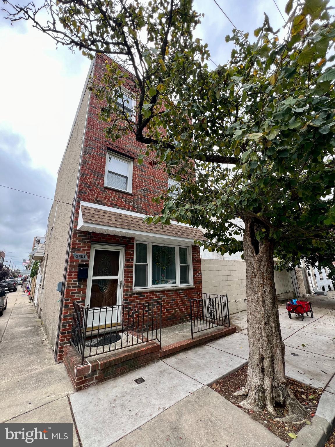 a front view of a house with parking