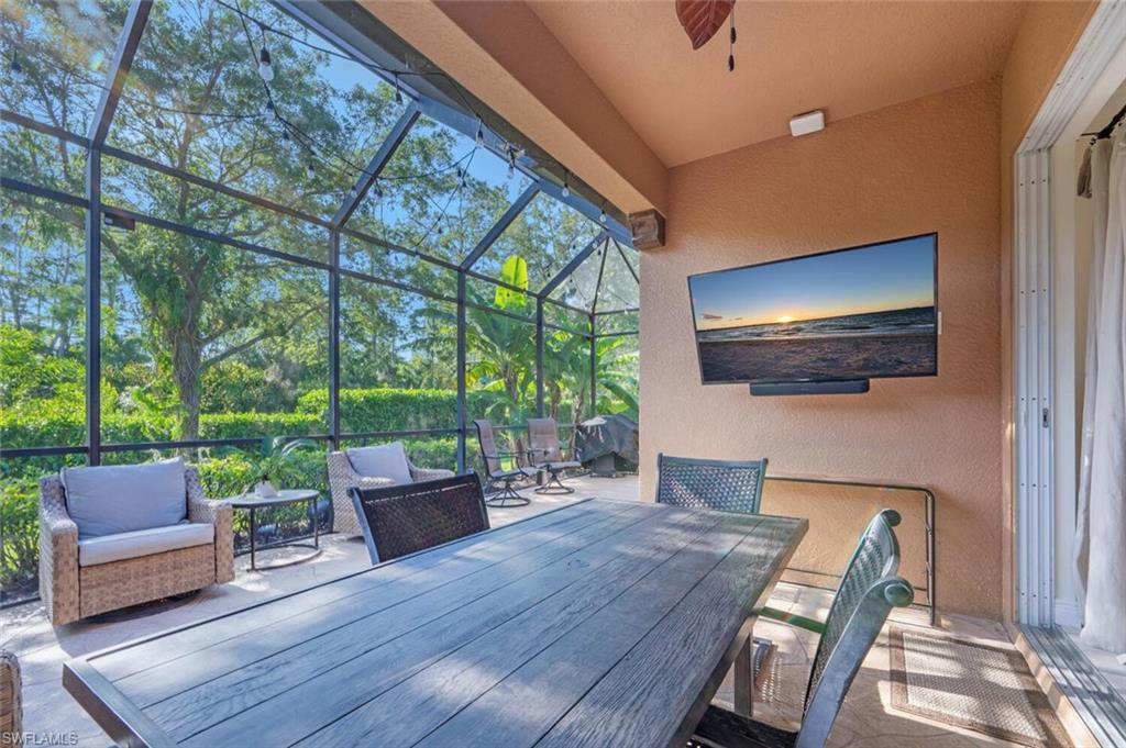 a outdoor living space with furniture and a flat screen tv