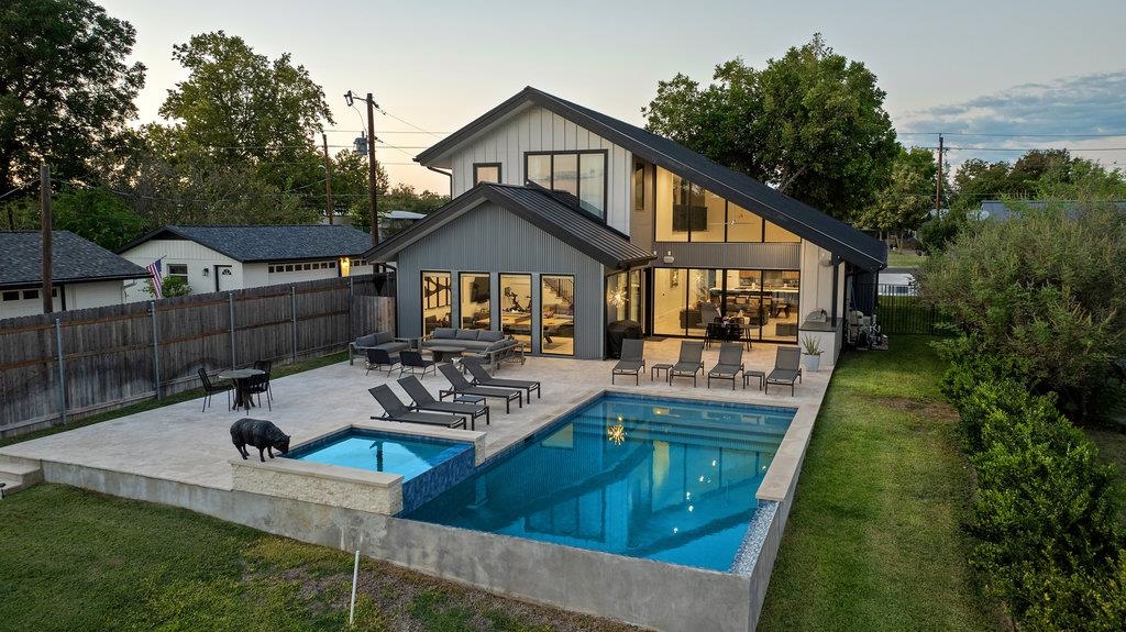 a front view of house with yard outdoor seating and green space