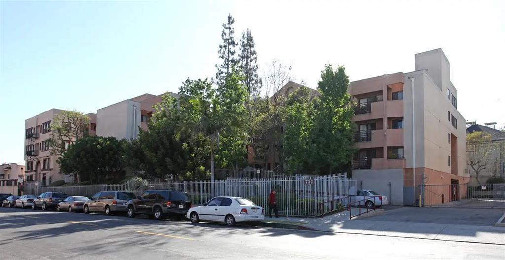 a view of street with parked cars