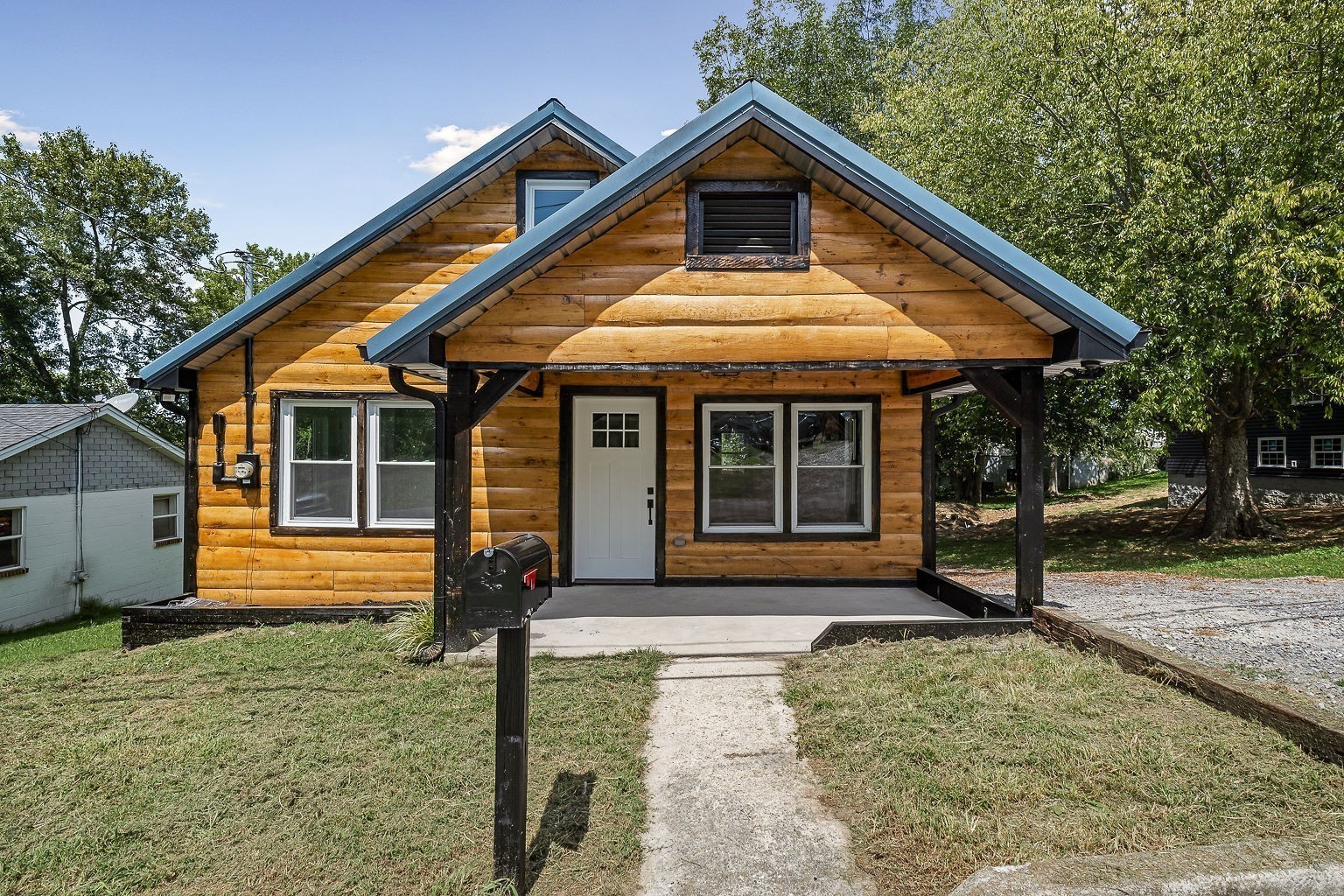 a front view of a house with a yard