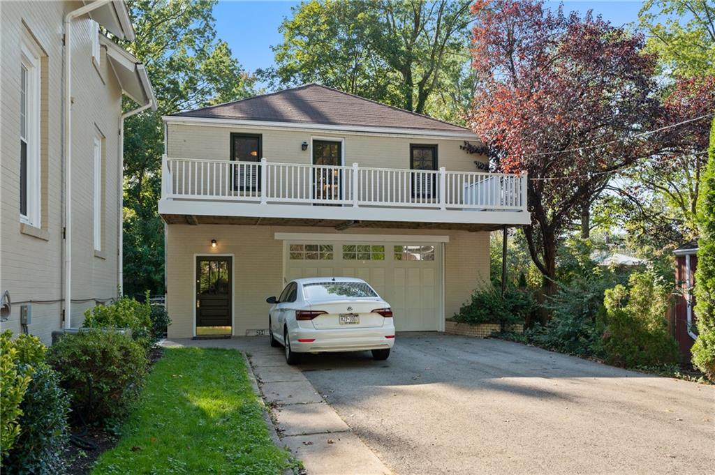 a car parked in front of a house