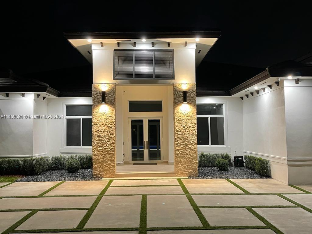 a front view of a house with a garage