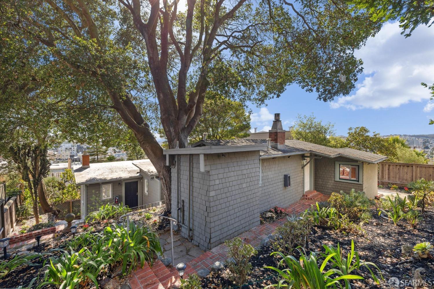 a front view of a house with garden