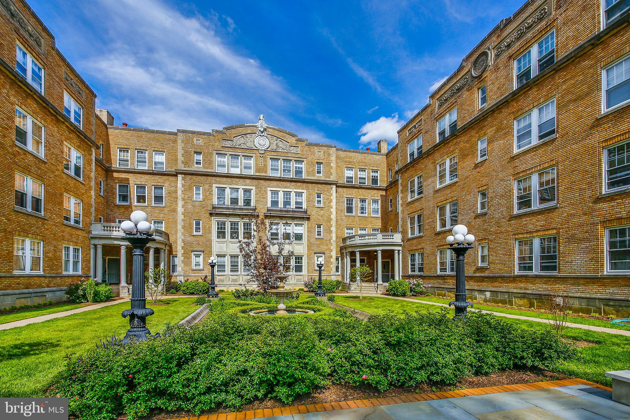 a view of a building with a yard