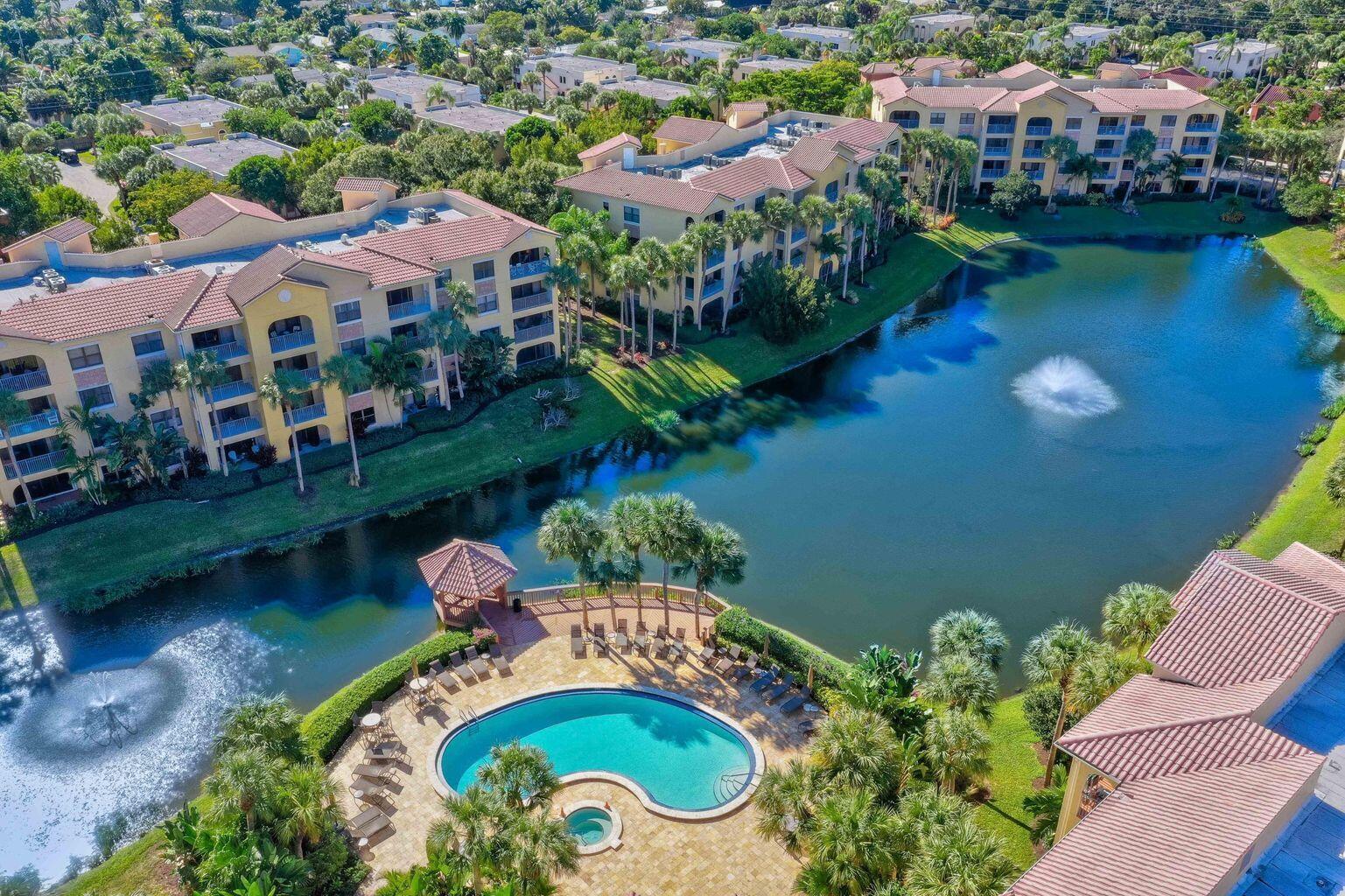 an aerial view of a house with a swimming pool yard and outdoor seating