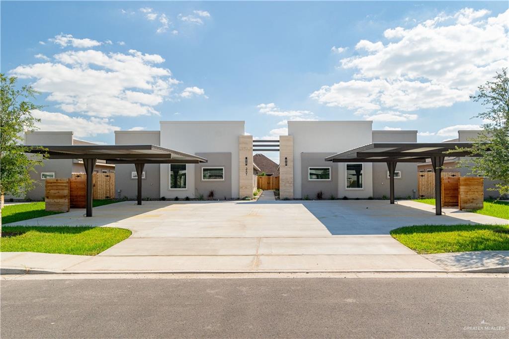 Modern home featuring a carport