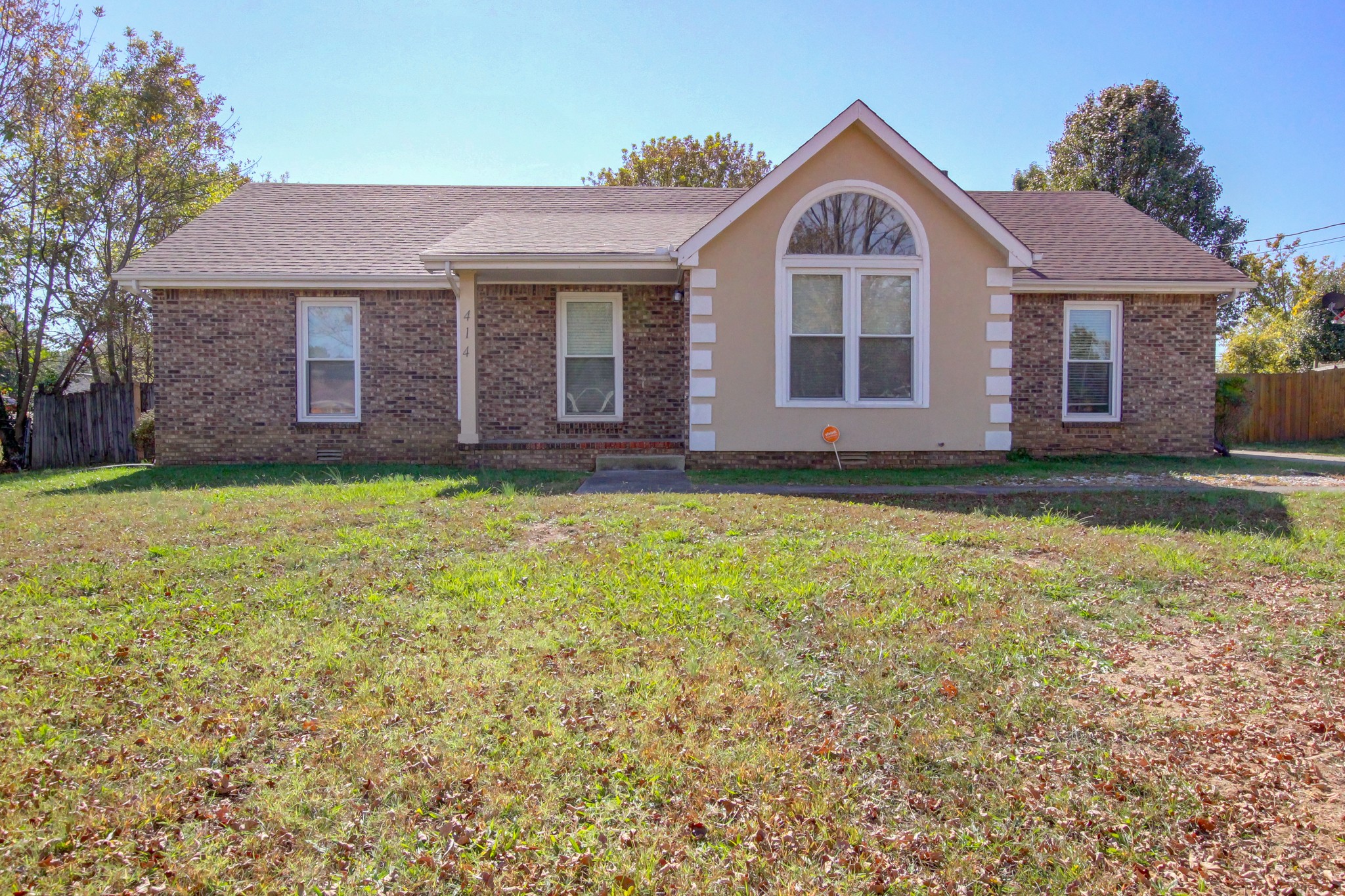 a view of a yard in front of a house with a yard