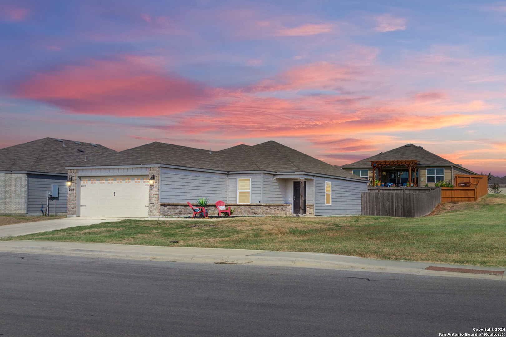 front view of a house with a yard