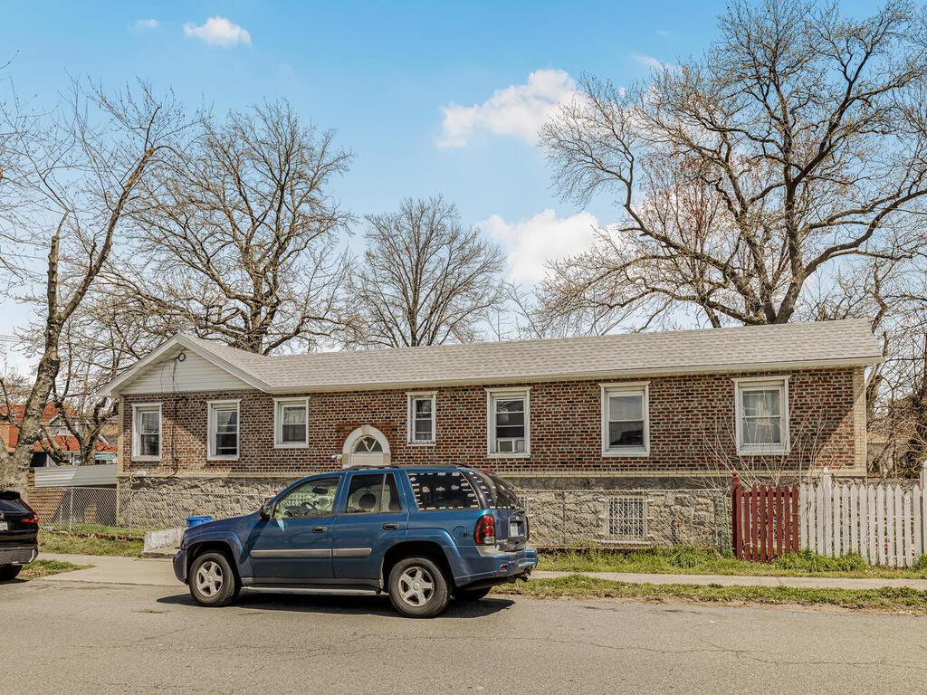 a car parked in front of a house