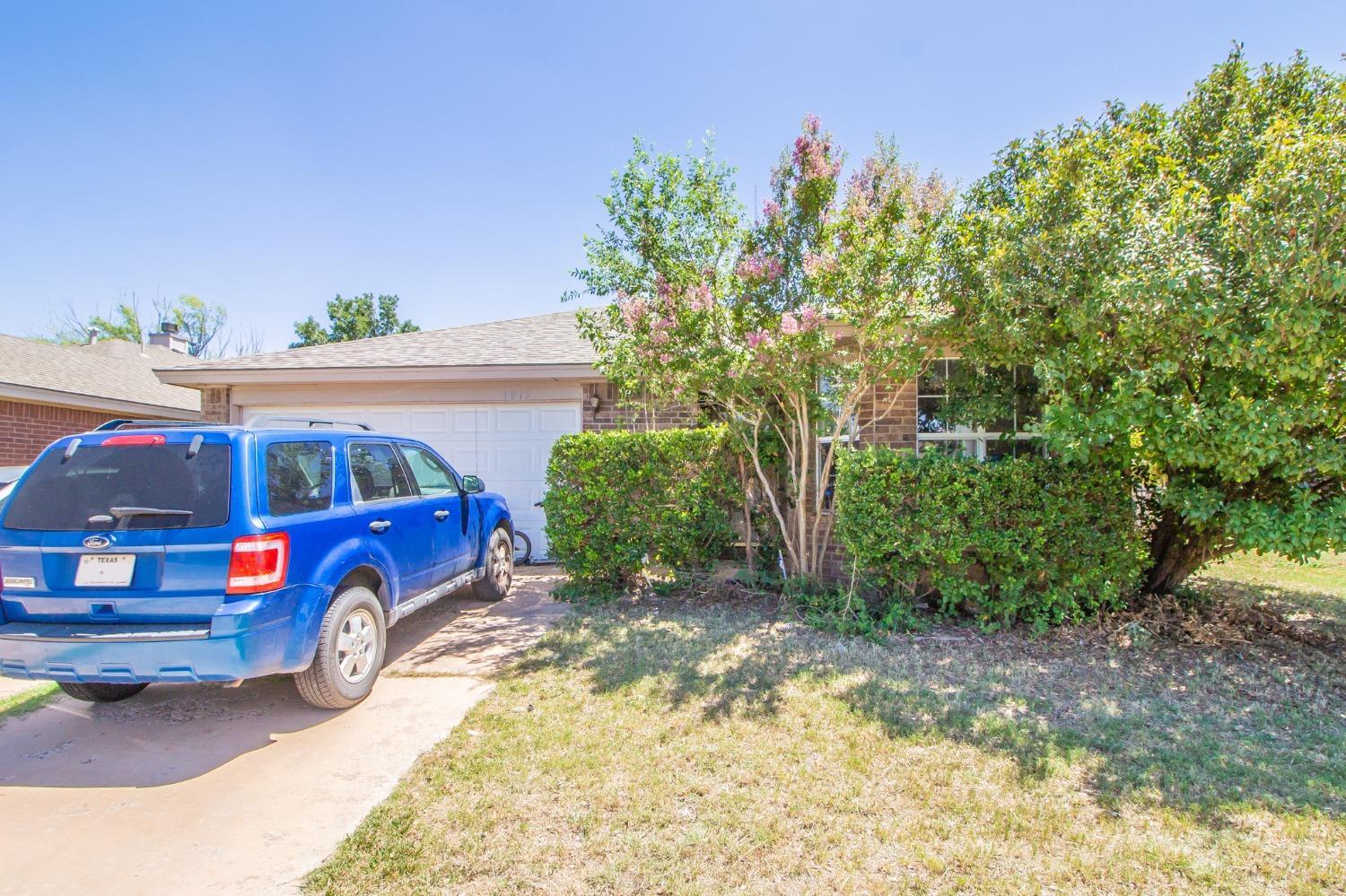 a car parked in front of a house