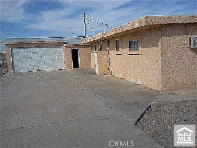 a front view of a house with garage