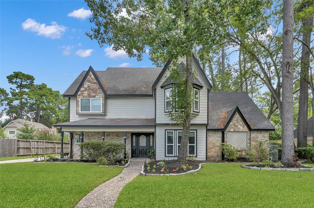 Welcome to the charming and versatile 16810 Spring Creek Oaks Ct!