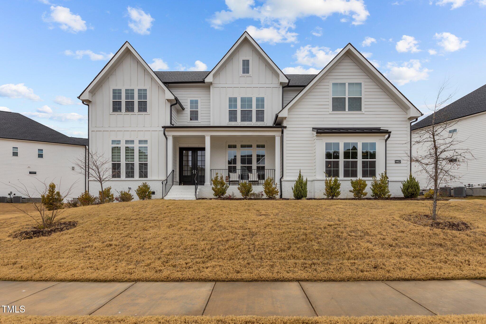 a front view of a house with yard