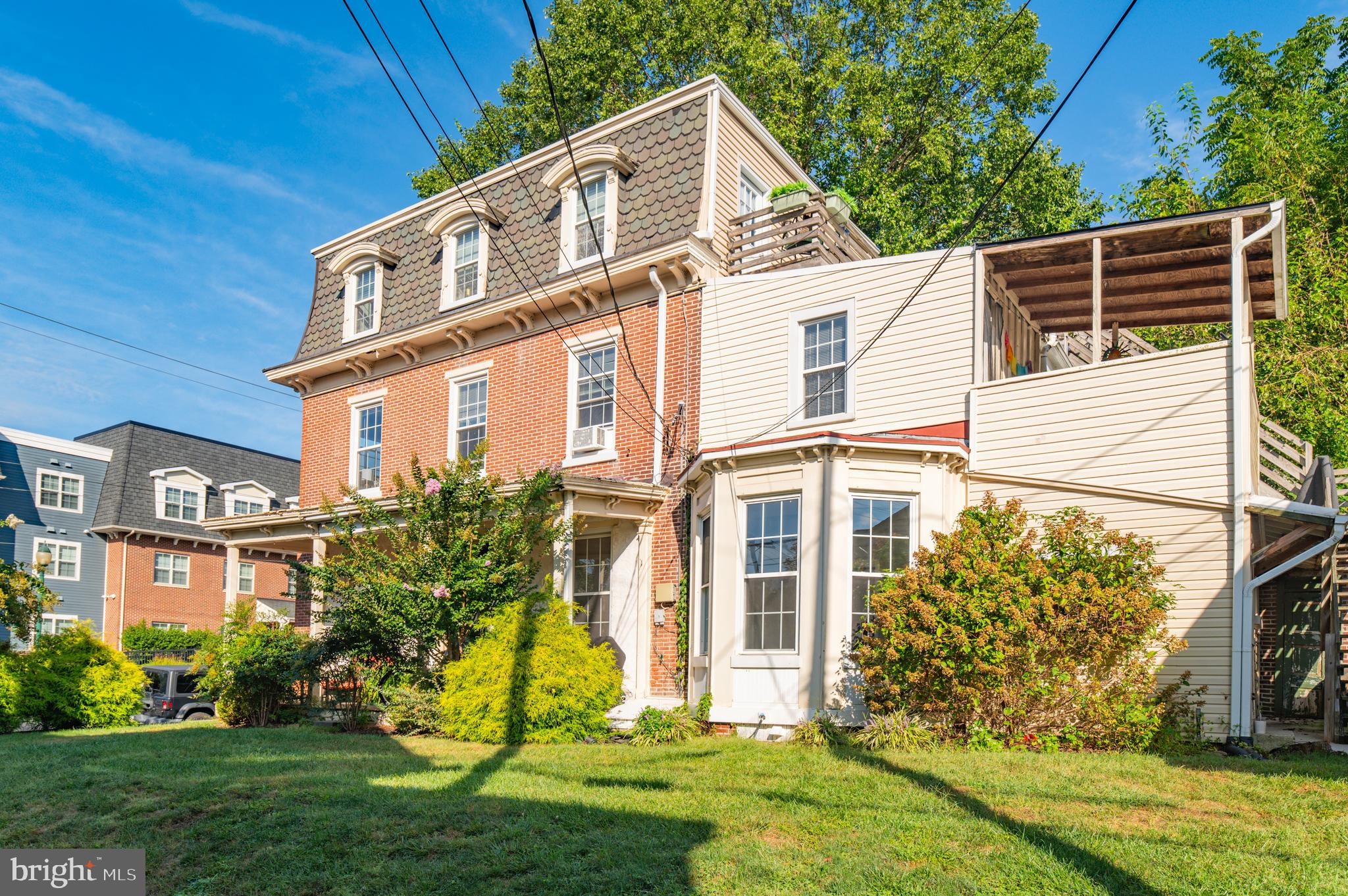 a view of a house with a yard and plants